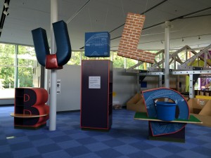 Shelving and hanging letters create the word BUILD