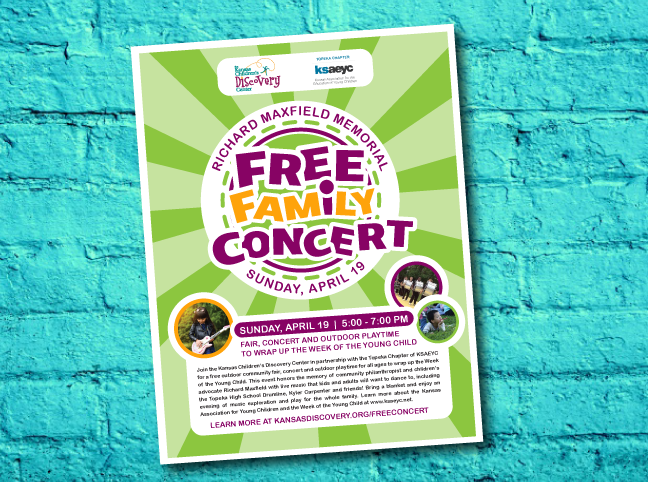 Free Family Concert poster with information posted on a teal brick wall
